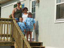 The Hunter family with their new home
