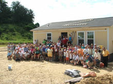 Group photo in front of the home