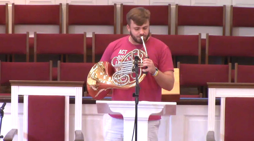 Playing a french horn